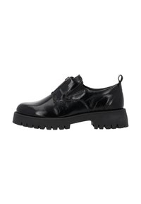 Chaussure en cuir verni noir avec semelle épaisse à crampons, fermeture éclair sur le côté et tirant à l'arrière, photographiée sur fond blanc.