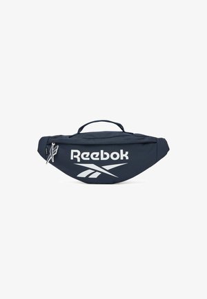 Granatowa nerka Reebok z białym logo, główną przednią kieszenią zapinaną na zamek oraz górnym uchwytem do przenoszenia.