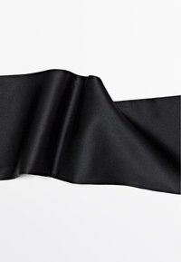 Black satin ribbon, smooth texture, flowing design, slight sheen, folded in elegant waves, with a solid black color throughout.