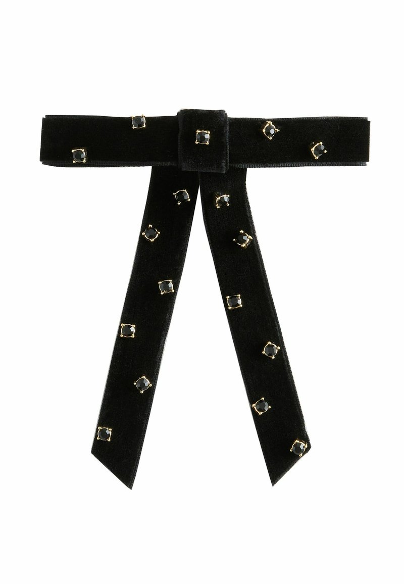 Black velvet ribbon belt with gold accents, featuring rectangular black gems. Ribbon has a central knot and two long, trailing ends.