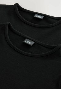 Two black t-shirts with round necks, made of soft cotton, featuring visible labels with "NEXT" branding on the inner neckline.