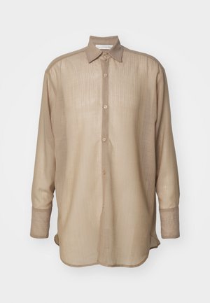 Beige long-sleeve shirt made of textured fabric. Features a button-up front, vertical stripes, a collar, and cuffed sleeves.