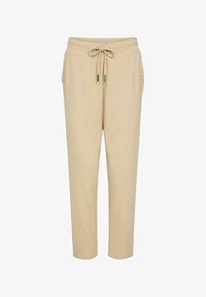 Beige tapered pants with elastic waistband, drawstring tie, and ruched side pockets, designed for casual wear.
