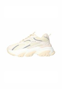 Crème mesh sneaker met lichtgrijze accenten, dikke witte zool en gebogen ontwerp. Heeft een ronde neus en vetersluiting.