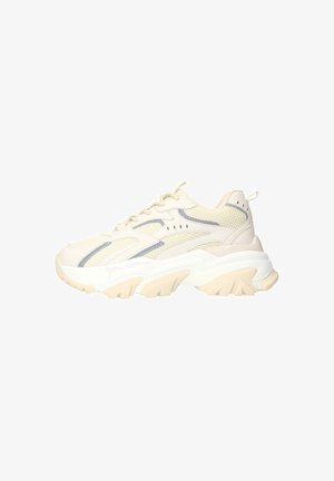 Cream mesh sneaker with light grey accents, thick white sole, and curved design. Features rounded toe and lace-up closure.