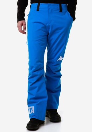 Pantaloni da sci blu brillante realizzati in materiale resistente, con una vestibilità ampia, tasche e branding bianco sui lati.