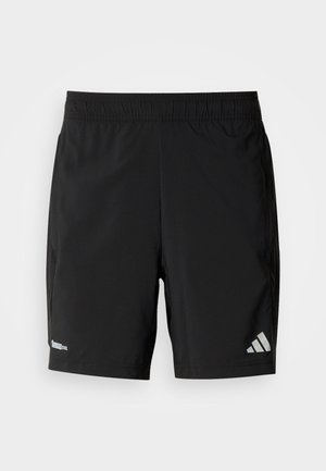 Svarta atletshorts av lätt material med resår i midjan, fickor i sidan och en reflekterande logotyp på ena benet.