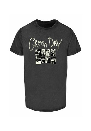 Schwarzes Baumwoll-T-Shirt mit kurzen Ärmeln. Die Vorderseite zeigt "Green Day" in weißem Text über einem Raster aus Schwarz-Weiß-Bildern. Rundhalsausschnitt.