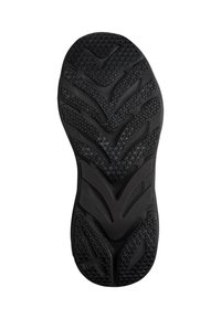Semelle de chaussure en caoutchouc noir avec motifs texturés, incluant des formes en chevron et triangulaires pour une bonne adhérence sur surfaces lisses.