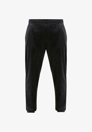 Mustad sametist joggers, millel on pehme tekstuur, kitsenevad sääred ja elastne vöökoht. Omab minimaalset disaini, ilma nähtavate detailideta.