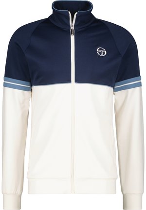 Herren-Trainerjacke in Marineblau und Creme. Aus glattem Stoff gefertigt, verfügt über einen hohen Kragen, einen Frontreißverschluss und gestreifte Akzente an den Ärmeln. Logo auf der Brust.