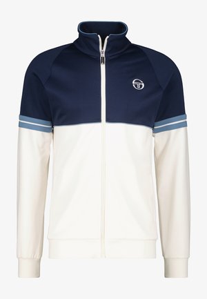 Herren-Trainerjacke in Marineblau und Creme. Aus glattem Stoff gefertigt, verfügt über einen hohen Kragen, einen Frontreißverschluss und gestreifte Akzente an den Ärmeln. Logo auf der Brust.