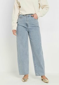 Jeans azzurri a vita alta con gamba ampia, in denim, con design a cinque tasche e una texture leggermente sbiadita.