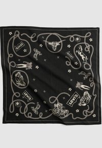 Bandana noire avec bordure en corde beige, illustrations sur le thème cowboy incluant une tête de bovin, des chevaux, des figures de cowboys et des logos Levi's.