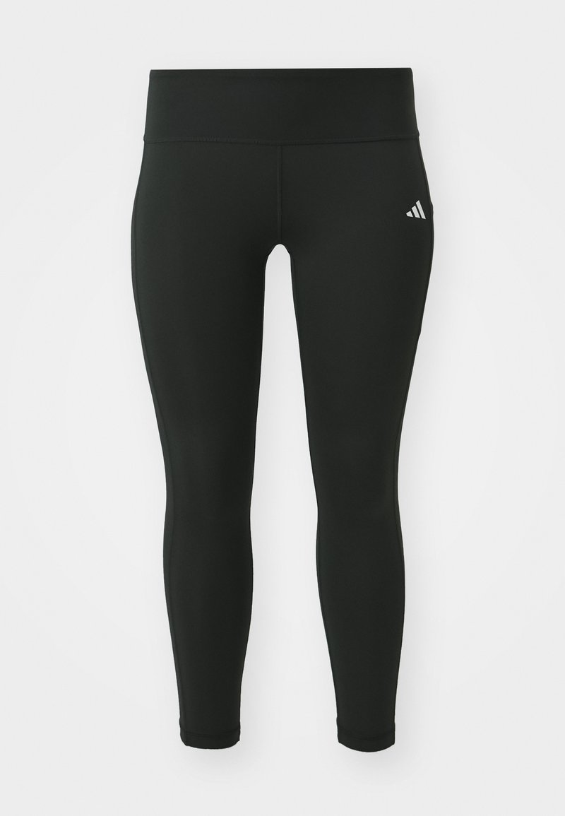 Leggings de sport noirs en matériau extensible. Conception à taille haute avec une texture lisse et un logo blanc discret sur la cuisse gauche.