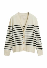 Gilet beige avec des rayures horizontales navy, boutons dorés, et un col en V. Il est doté de manches longues et d'une texture tricot douce.