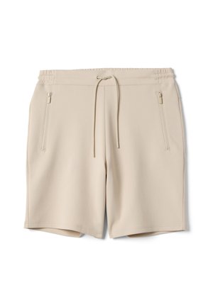 Pantaloncini casual beige con cintura elastica, coulisse e tasche laterali con zip, mostrati distesi su uno sfondo bianco.