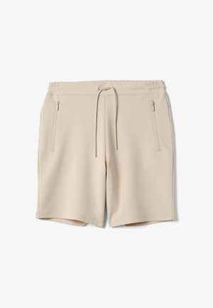 Beige casual shorts with elastic waistband, drawstring, and zippered side pockets, displayed flat on a white background.