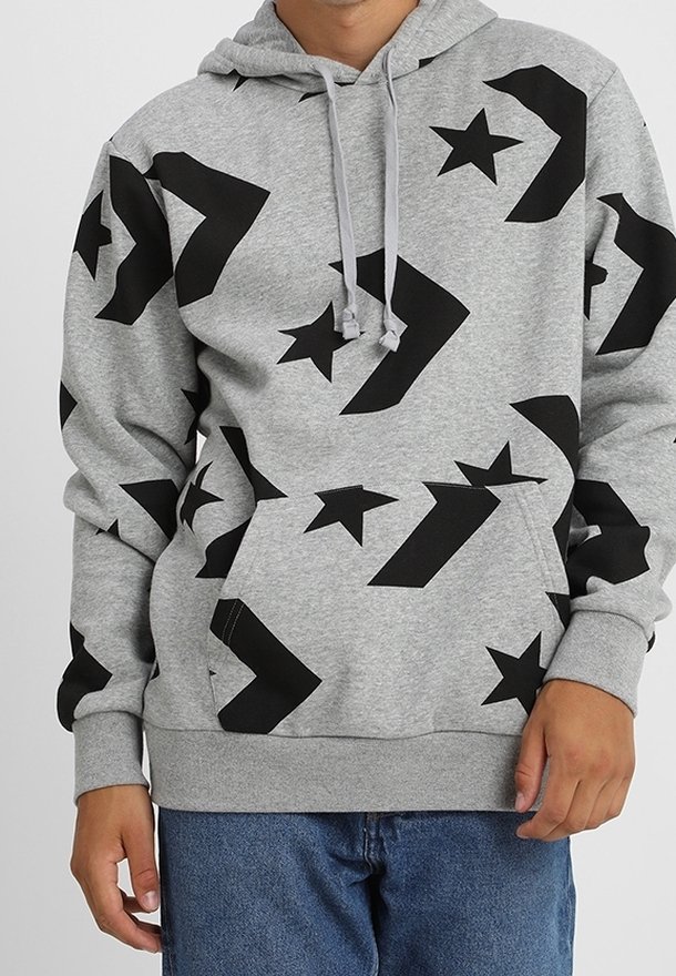 Gray hoodie featuring black geometric and star patterns, with a front pocket, drawstring hood, and ribbed cuffs and hem. Cotton blend material.
