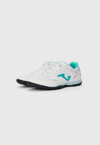 White athletic shoes with turquoise accents, textured mesh upper, black rubber sole, and notable logo detail on the side.