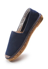 Navy canvas espadrille with a rounded toe, jute detailing around the sole, and a flat, flexible rubber outsole. Handmade in Spain.