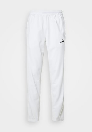 Pantalones atléticos blancos con una cinturilla elástica, piernas ajustadas y un logo negro de Adidas en el muslo izquierdo. Tejido suave y ligero.