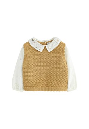 Beige gestrickte Sweaterweste mit Rautenmuster, darunter eine weiße Bluse mit gestickten Blumenmotiven und rundem Kragen.
