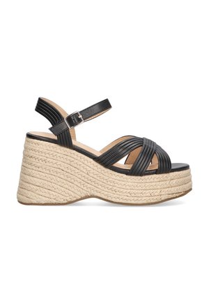 Sandalias de cuña de cuero negro con correas trenzadas, que cuentan con una suela intermedia de yute trenzado y una correa de tobillo con hebilla.