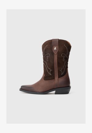 Brown leather cowboy boot with a suede shaft, detailed stitching, pointed toe, and a low black heel. Decorative white patterns visible.
