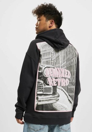 Black sweatshirt with a hood, featuring a large graphic print of a vintage car and the text "Remixed Retro" in pink. Soft fabric, relaxed fit.