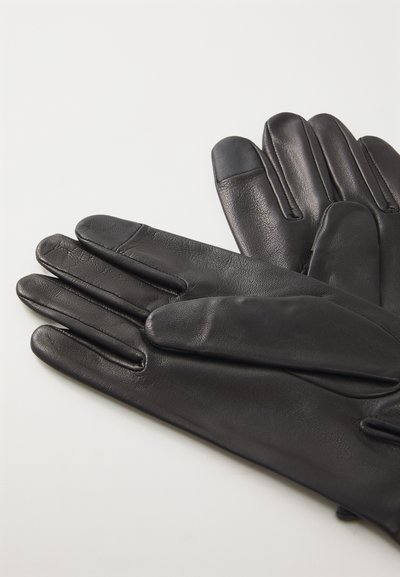 Gants en cuir noir avec quatre doigts et un pouce, présentant une texture lisse et des coutures soignées. Les extrémités des doigts ont un design d'accent subtil.