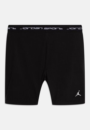 Fekete sportnadrág, szoros fazonban, fehér „Jordan Sport” logóval a derékrészen és fehér Jumpman szimbólummal a bal alsó lábszáron.