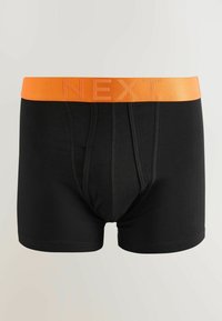 Boxers pour hommes noirs avec une ceinture orange arborant le nom de la marque "NEXT" en relief sur un fond uni.
