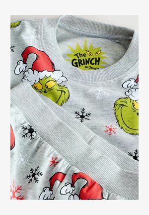 Pelēks džemperis ar Grinča grafiku, sarkano Ziemassvētku cepuri un sniegpārsliņu rakstu. Ribotas aproces un apkakle ar teksturētu apdari.