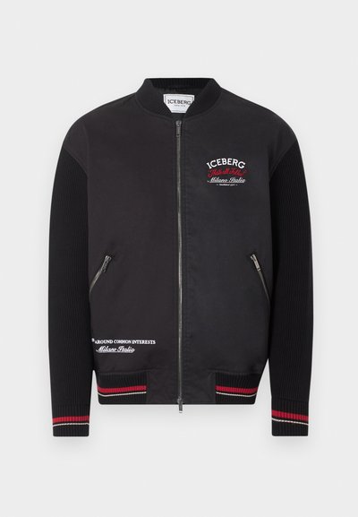 Μαύρο μπουφάν τύπου bomber με ριμπ μανίκια, μανσέτες με κόκκινες και λευκές ρίγες, φερμουάρ μπροστά, τσέπες με φερμουάρ και λευκό-κόκκινα λογότυπα "Iceberg Milano Italia".