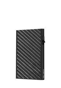 Black carbon fiber wallet with a textured surface, slim rectangular shape, and a side-opening mechanism. Features the "TRU VIRTU" logo.