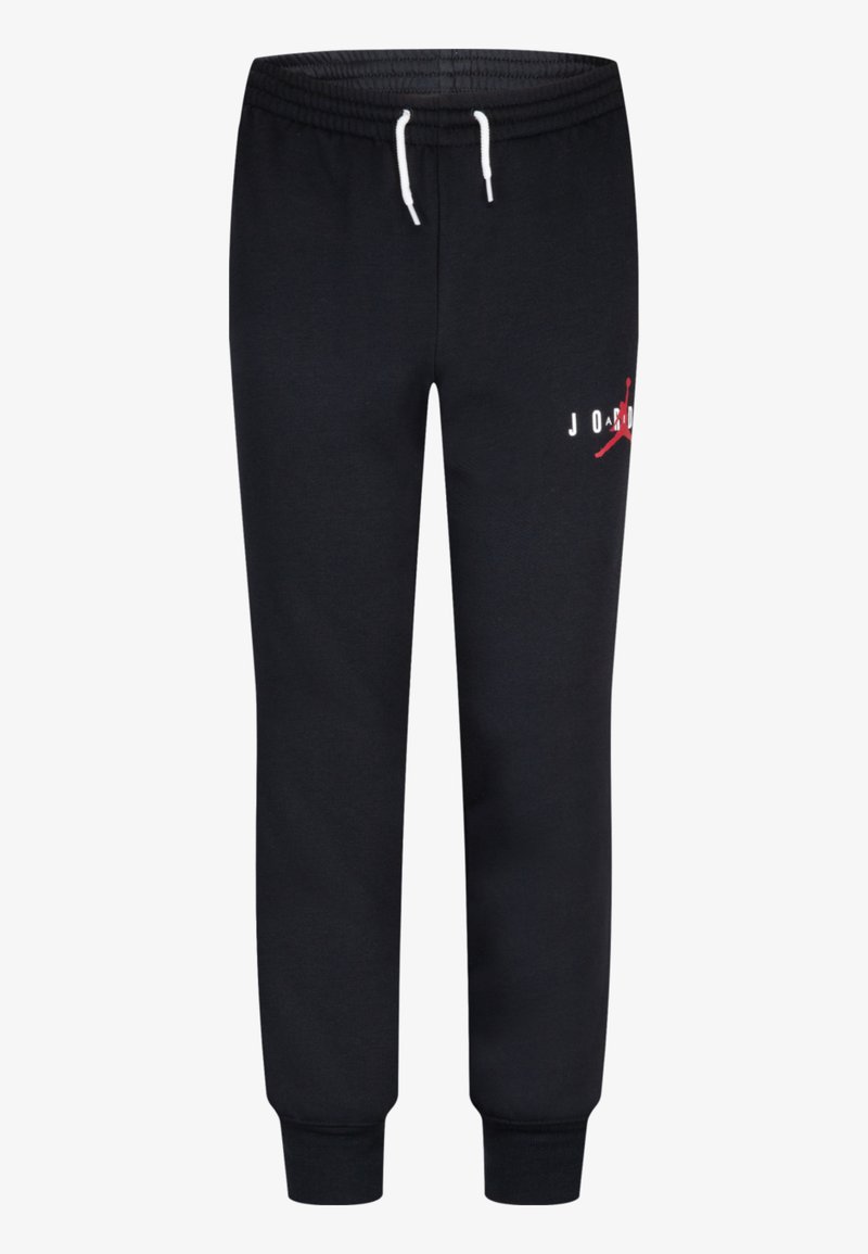 Pantalon de survêtement noir en tissu doux, avec une taille élastique dotée de cordons blancs et un accent de logo rouge sur le côté gauche.