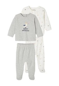 Two baby outfits: a gray top with "PETIT MATELOT" text and a seagull graphic, and white bottoms with multicolored patterns. Soft cotton material.
