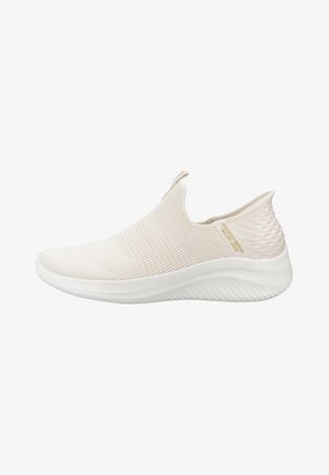 Slip-on athletic shoes in beige fabric with a textured, breathable mesh upper and a white sole featuring a wave pattern for grip.