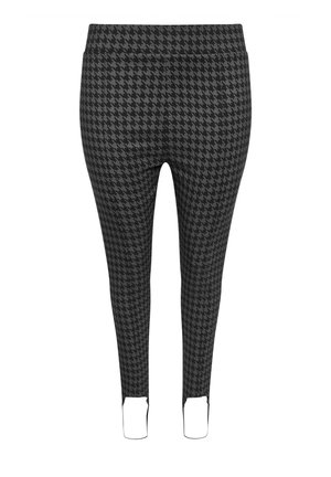 Leggings a fantasia houndstooth bianca e nera con una texture liscia, design affusolato e aperture alle caviglie. Vita elastica per il massimo comfort.