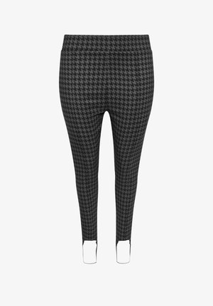 Schwarze und graue Hahnentrittmuster-Leggings mit glatter Textur, tailliertem Design und Ausschnitten an den Knöcheln. Elastischer Bund für Komfort.