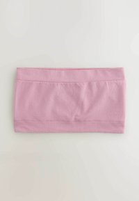 Haut tube rose doux sans coutures avec bords côtelés, posé à plat sur une surface claire.