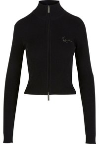 Sweat à zip noir côtelé avec un col haut, des manches longues et une coupe ajustée. Il arbore un petit logo brodé sur la poitrine.