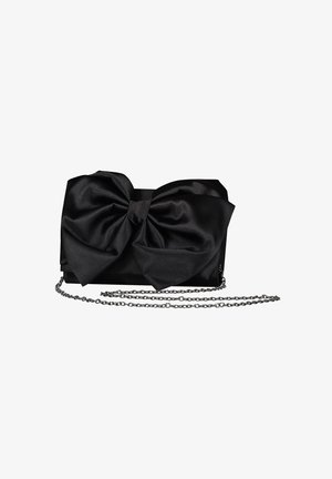 Black satin clutch with a large bow detail on the front, rectangular shape, and a thin chain strap. Smooth texture and minimal hardware.