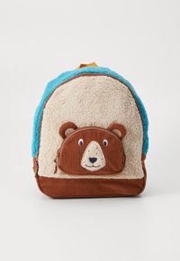 Rugsekk med rund form. Laget av blått, fuzzy materiale, beige plysj foran og brune kordfløyelsdetaljer. Har et bjørneansiktsdesign.
