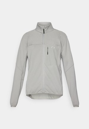 Γκρι ζακέτα με φερμουάρ και ψηλό γιακά, κατασκευασμένη από μαλακό ύφασμα. Διαθέτει τσέπη στο στήθος και ενισχυμένες ραφές για ανθεκτικότητα.