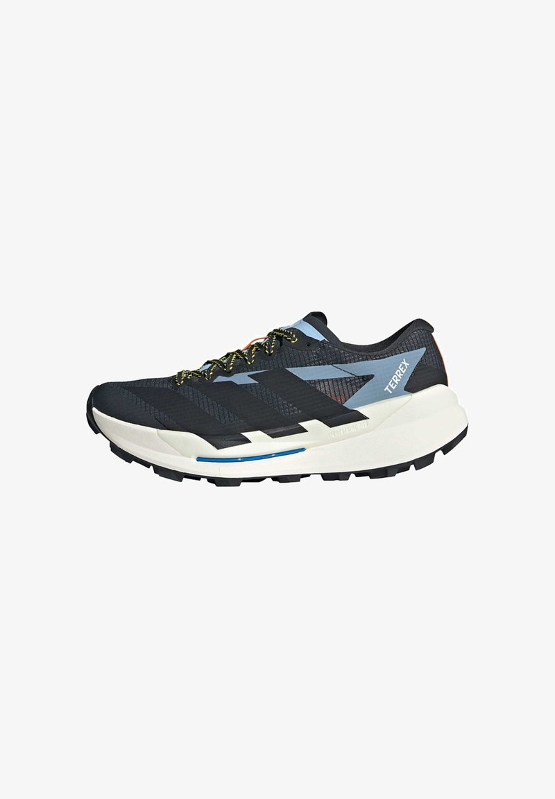 Chaussure de course noire et bleue avec une tige en maille texturée, des lacets jaune-vert, une semelle intermédiaire blanche et une semelle extérieure noire robuste. "TERREX" affiché sur le côté.