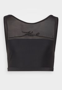 Svart kort topp laget av glatt stoff med gjennomsiktig mesh øverst og brodert "Karl"-logo på forsiden. Rund halslinning og uten ermer.