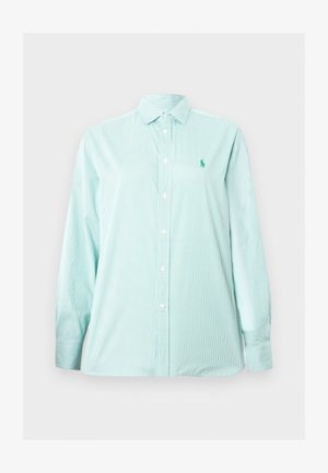 Hele sinine ja valge triibuline pikade varrukatega nööpidega särk, millel on krae ja vasaku rinna peal peen tikitud logo.