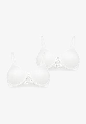 Vitt BH-set med mjuka kupor, justerbara band och en texturerad detalj i mitten. Tillverkad av mjukt tyg med en sömlös design.